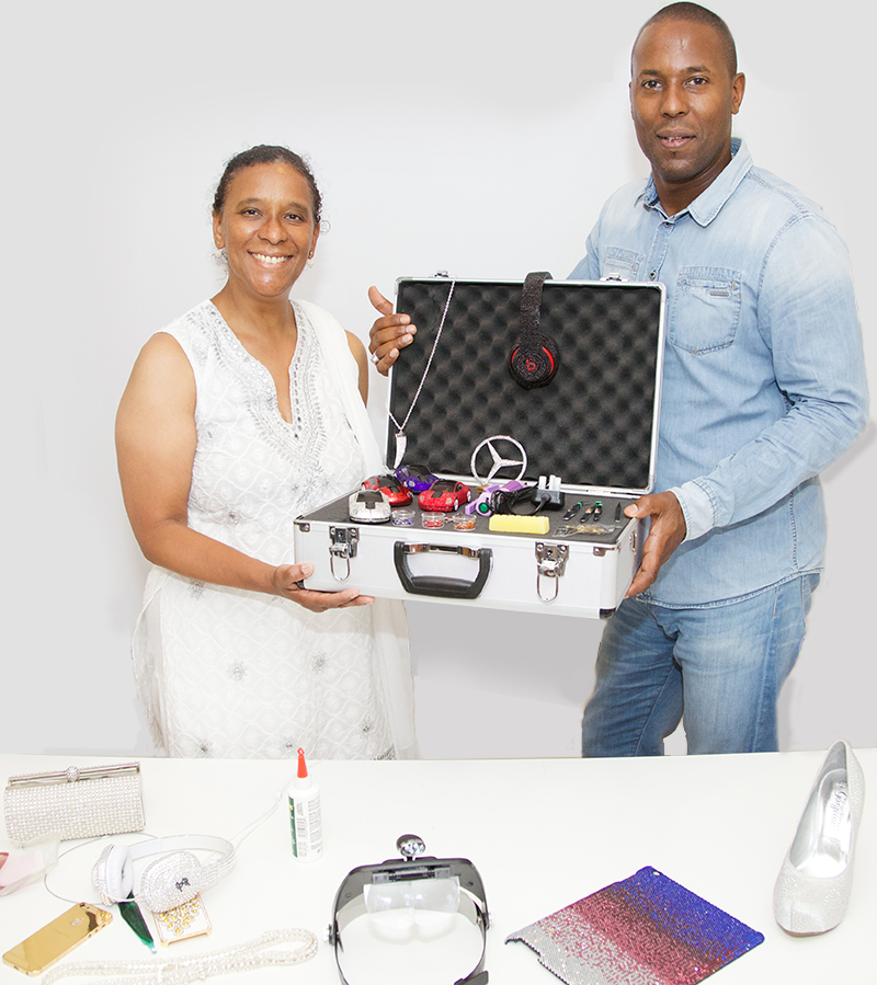 Laban Roomes presents Joan Celestin with the Crystalgenie Business Opportunity System