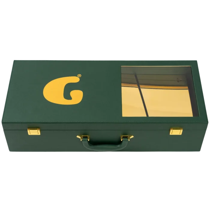 Closed green Goldgenie presentation case with gold PS5 visible through its window